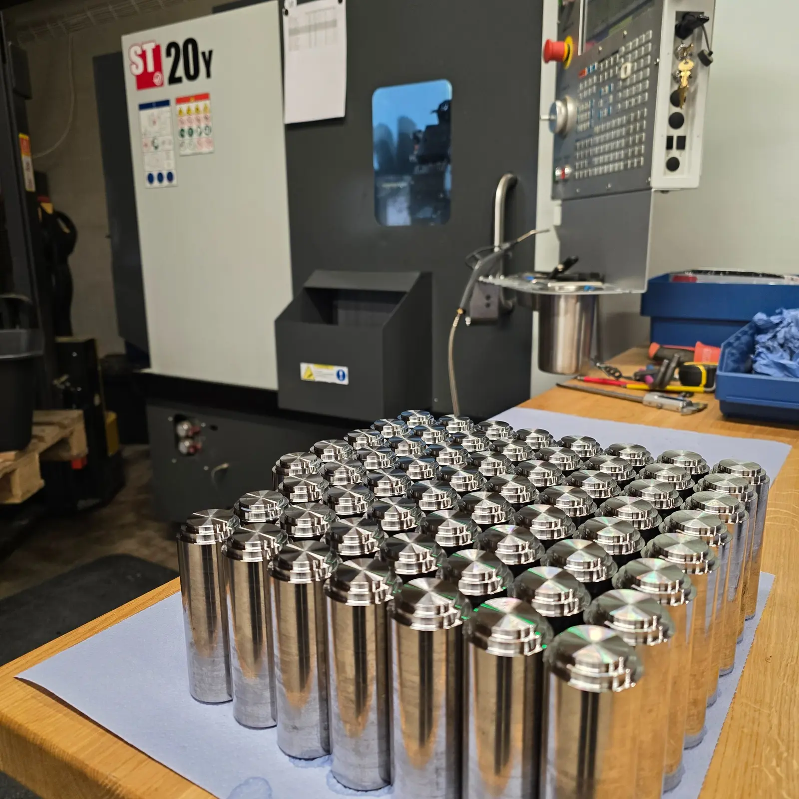 Haas ST-20Y CNC lathe and finished parts in the TaggoTech workshop