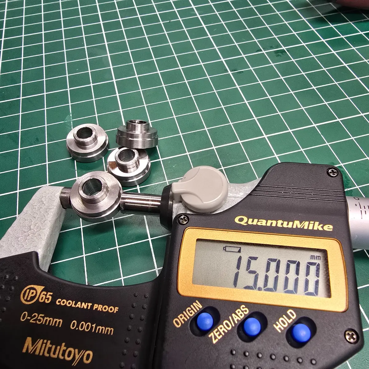 Inspecting a finished part with a digital micrometer